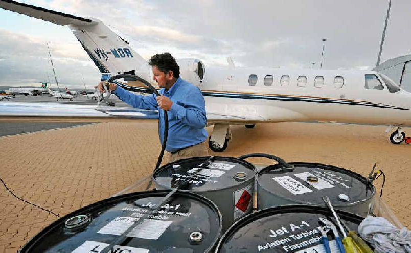 Linc Energy CEO and managing director Peter Bond refuels his jet with the new fuel. Linc Energy CEO and managing director Peter Bond refuels his jet with the new fuel.